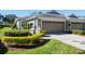 Attractive single-story home with two-car garage and well-manicured landscaping at 5733 Heronpark Pl, Lithia, FL 33547