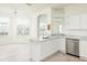 Open-concept kitchen and dining area with abundant natural light and modern stainless appliances at 5733 Heronpark Pl, Lithia, FL 33547