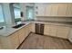 Lovely kitchen with granite countertops, stainless dishwasher and white cabinetry at 5733 Heronpark Pl, Lithia, FL 33547