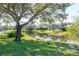 Scenic view of a tranquil lake with lush green landscape at 5733 Heronpark Pl, Lithia, FL 33547