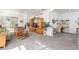 Spacious living room showcasing a built-in entertainment center and home office at 5733 Heronpark Pl, Lithia, FL 33547