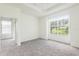 Spacious main bedroom with ample closet space, large windows and neutral carpet at 5733 Heronpark Pl, Lithia, FL 33547