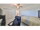 Bedroom with a double bed, desk, and ceiling fan at 703 Rutgers Pl, Sun City Center, FL 33573