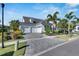 Two-story home with three-car garage and paver driveway at 712 Manns Harbor Dr, Apollo Beach, FL 33572