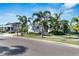 Two-story house with lush landscaping and palm trees at 712 Manns Harbor Dr, Apollo Beach, FL 33572