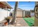 Backyard with shed, stone pathway, and partial artificial turf at 7505 Eastmoor Ct, Tampa, FL 33615