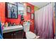 Clean bathroom with shower/tub combo and red tile at 7505 Eastmoor Ct, Tampa, FL 33615