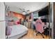 Bedroom with queen bed, desk, and pink chair at 7505 Eastmoor Ct, Tampa, FL 33615