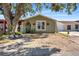 Charming one-story home with a green exterior and landscaping at 7505 Eastmoor Ct, Tampa, FL 33615