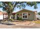 Charming single-story house with a tree in front at 7505 Eastmoor Ct, Tampa, FL 33615