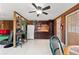 Compact kitchen with dark wood cabinets and a white refrigerator at 7505 Eastmoor Ct, Tampa, FL 33615