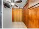 Kitchen hallway with wood cabinets and bi-fold doors at 7505 Eastmoor Ct, Tampa, FL 33615