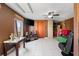 Bright living room featuring a TV, ceiling fan, and tiled floors at 7505 Eastmoor Ct, Tampa, FL 33615
