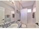 Clean bathroom with single vanity, shower/tub combo, and updated fixtures at 8312 Moccasin Trail Dr, Riverview, FL 33578