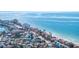 Aerial view of beach and oceanfront community at 9415 Blind Pass Rd # 601, St Pete Beach, FL 33706