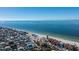 Aerial view of beach and oceanfront homes along the coast at 9415 Blind Pass Rd # 601, St Pete Beach, FL 33706
