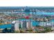 Aerial view of waterfront condo building with parking and boat slips at 9415 Blind Pass Rd # 601, St Pete Beach, FL 33706