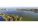 Aerial view of waterfront homes and a peaceful waterway at 9415 Blind Pass Rd # 601, St Pete Beach, FL 33706