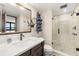 Clean bathroom with a large walk-in shower and modern vanity at 9415 Blind Pass Rd # 601, St Pete Beach, FL 33706