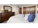 Serene bedroom with ensuite bathroom and dresser at 9415 Blind Pass Rd # 601, St Pete Beach, FL 33706