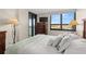 Bedroom with water views and dresser with ample storage at 9415 Blind Pass Rd # 601, St Pete Beach, FL 33706