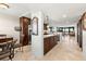 Modern kitchen with dark wood cabinets, granite countertops, and stainless steel appliances at 9415 Blind Pass Rd # 601, St Pete Beach, FL 33706