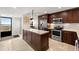 Modern kitchen with stainless steel appliances and island at 9415 Blind Pass Rd # 601, St Pete Beach, FL 33706