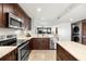Modern kitchen with stainless steel appliances and island at 9415 Blind Pass Rd # 601, St Pete Beach, FL 33706