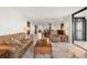 Relaxing living room with leather furniture, large windows, and water views at 9415 Blind Pass Rd # 601, St Pete Beach, FL 33706