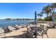 Relaxing patio area with tables, chairs, and waterfront views at 9415 Blind Pass Rd # 601, St Pete Beach, FL 33706