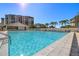 Inviting community pool with ample lounge space at 9415 Blind Pass Rd # 601, St Pete Beach, FL 33706