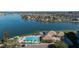 Community pool and clubhouse with water view and parking at 9415 Blind Pass Rd # 601, St Pete Beach, FL 33706