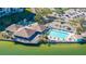 Aerial view showing community pool, clubhouse, and waterfront location at 9415 Blind Pass Rd # 601, St Pete Beach, FL 33706