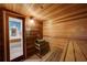 Relaxing sauna with wooden walls and bench seating at 9415 Blind Pass Rd # 601, St Pete Beach, FL 33706