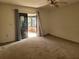 Living room with sliding doors leading to a patio at 9730 San Vincente Way, Port Richey, FL 34668