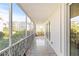 Long screened balcony overlooking courtyard and other building units at 1012 N Shore Ne Dr # 14, St Petersburg, FL 33701