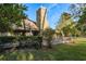 House exterior showcasing deck and landscaping at 102 Old Mill Pond Rd, Palm Harbor, FL 34683