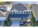 Two-story house with gray exterior, two-car garage and landscaped yard at 10507 Daybreak Gln, Parrish, FL 34219