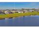 Aerial view of house by lake at 10507 Daybreak Gln, Parrish, FL 34219