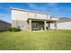 Two-story house with large backyard and covered patio at 10507 Daybreak Gln, Parrish, FL 34219