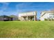 House with a large grassy backyard at 10507 Daybreak Gln, Parrish, FL 34219