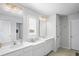 Double vanity bathroom with white cabinets and plenty of counter space at 10507 Daybreak Gln, Parrish, FL 34219