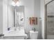 Clean bathroom with vanity, toilet, shower, and mirror at 10507 Daybreak Gln, Parrish, FL 34219