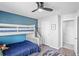 bedroom with a bunk bed and blue accent wall at 10507 Daybreak Gln, Parrish, FL 34219