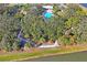 Walking path winds through lush landscaping near the lake at 10507 Daybreak Gln, Parrish, FL 34219