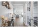 Bright and spacious entryway with hardwood floors and views to the living room at 10507 Daybreak Gln, Parrish, FL 34219