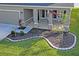 Landscaped front yard with a curved stone border at 10507 Daybreak Gln, Parrish, FL 34219