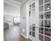 Home office or gym with glass French doors and wood floors at 10507 Daybreak Gln, Parrish, FL 34219