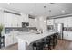 Spacious kitchen featuring white cabinets, quartz countertops, and stainless steel appliances at 10507 Daybreak Gln, Parrish, FL 34219