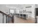 Modern kitchen with white cabinets, stainless steel appliances, and an island at 10507 Daybreak Gln, Parrish, FL 34219
